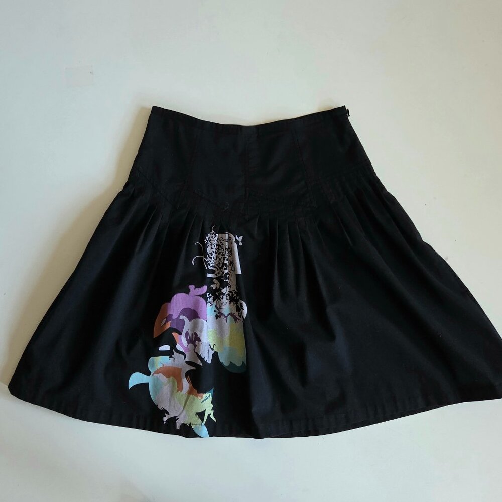 St-martins black skirt with bright colors accent and details on the top.